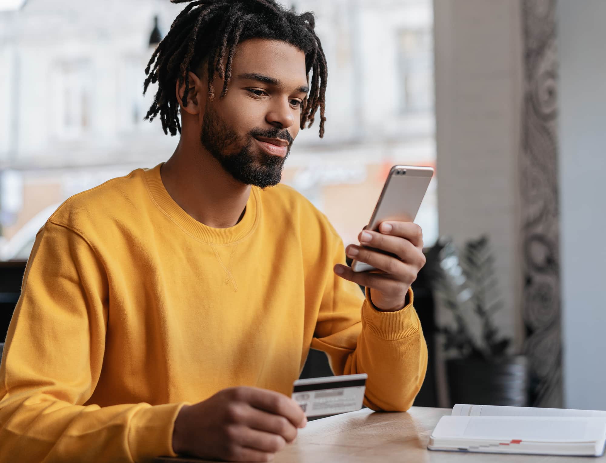 a man holding a phone a man holding a phone