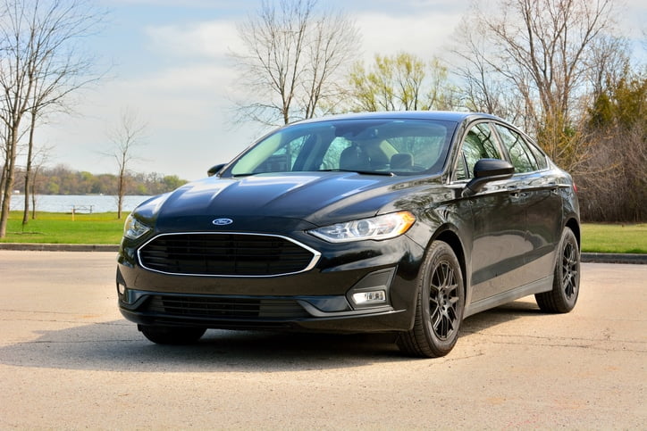 A new black sedan sitting in a parking lot purchased with an auto loan from Citizens Bank in Tennessee.