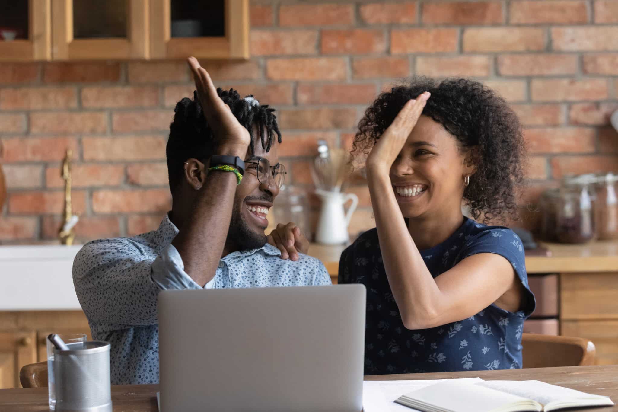 Nashville couple celebrating after budgeting and putting personal savings into their entertainment budget (fun fund) for later use.
