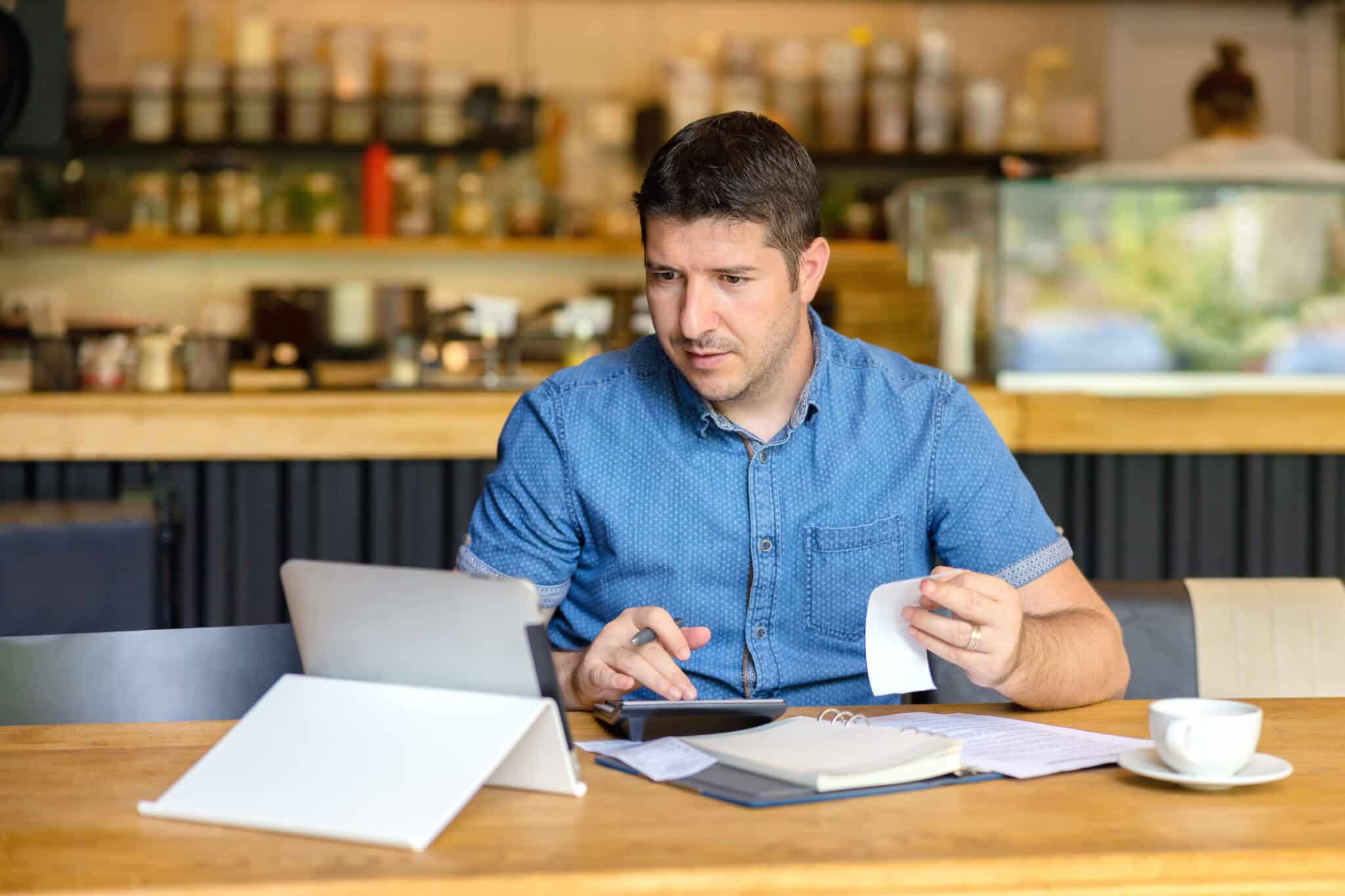 Entrepreneur using a business banking account to help run his startup in an organized and financially savvy manner.